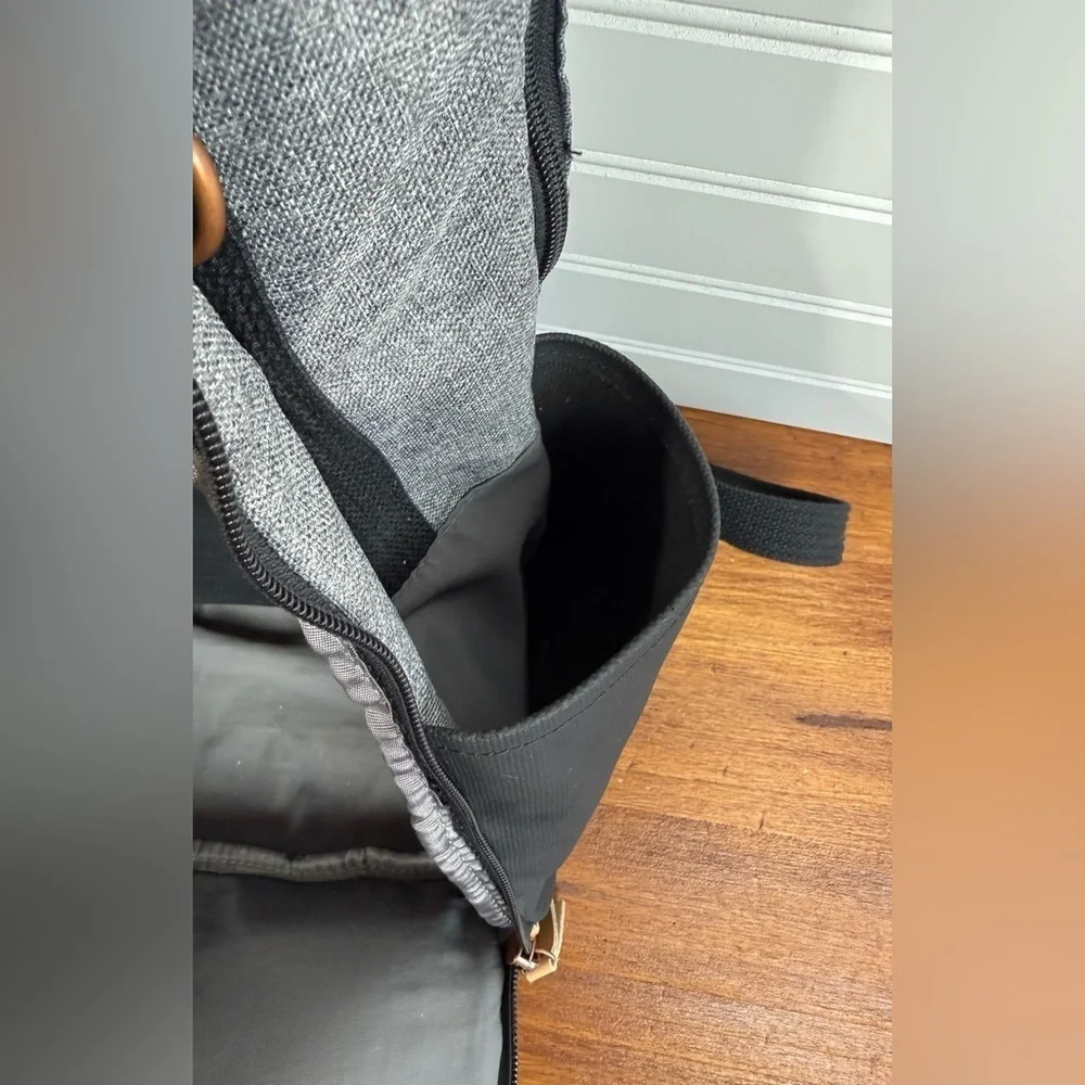 Petunia Pickle Bottom gray & black backpack shoulder diaper bag.